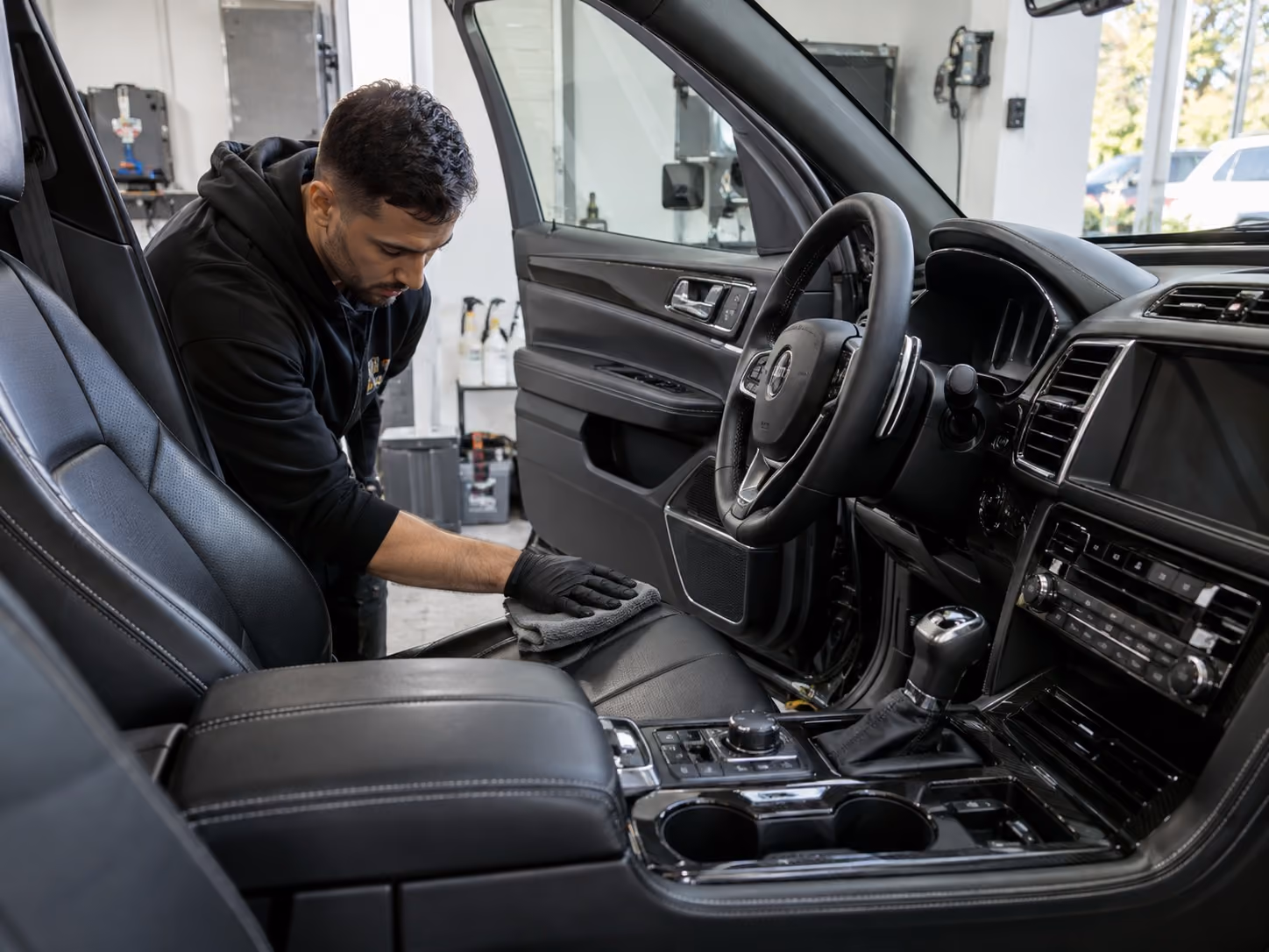 The family team behind Attention Detailing at work in the Nerang studio